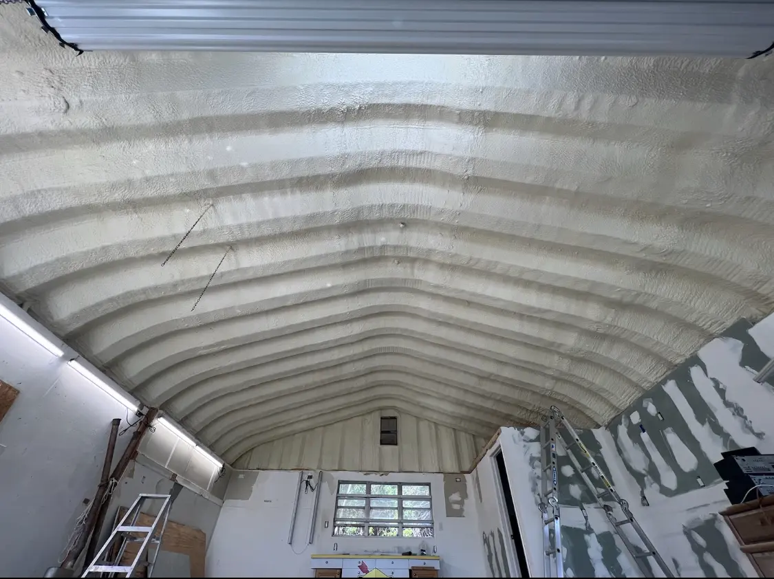 Spray polyurethane foam applied to the underside of a metal roof deck in St. Anthony